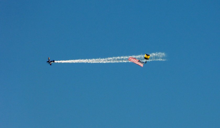 Parachutist and Acrobatic Airplane